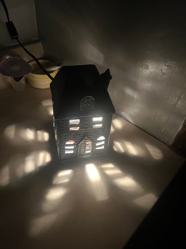 Customer photo review of Warmer: Haunted Mansion Canopy Illumination Fragrance Warmer