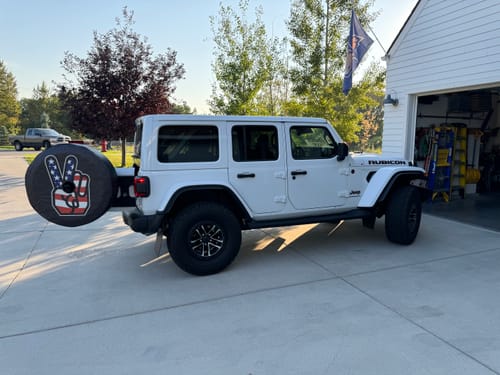 Customer photo review of American Flag Peace Sign Spare Tire Cover for Jeeps, Broncos, Campers, RV, Vans