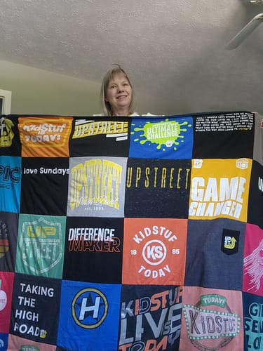 T-shirt quilt with community service, youth programs themes by Donna from GA
