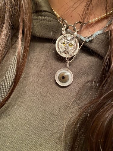 Customer photo review of Grey Hazel Blown Glass Eye Pendant with Halo