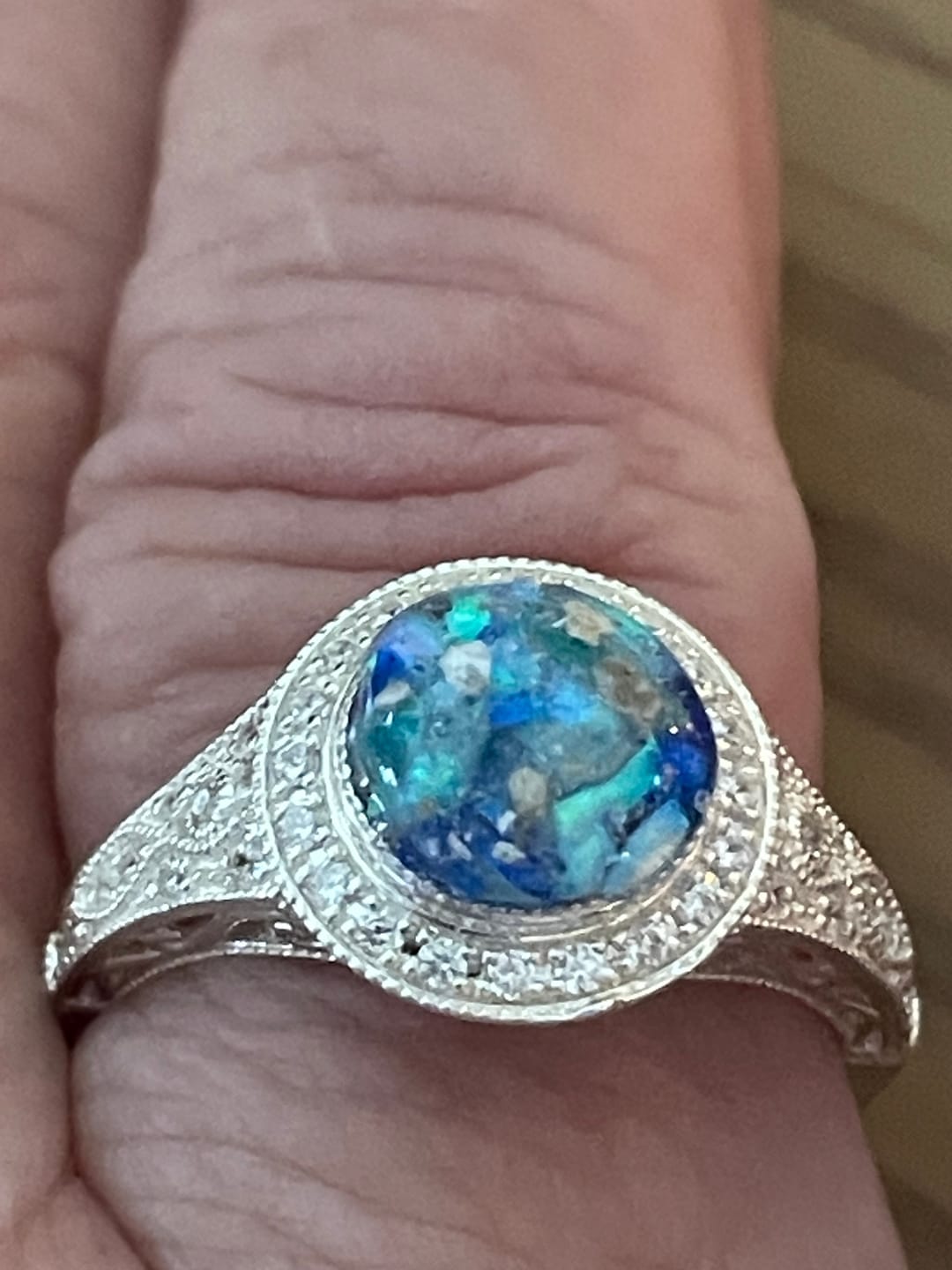 Customer photo review of Bedazzled Filigree Circle Opal Cremation Ring