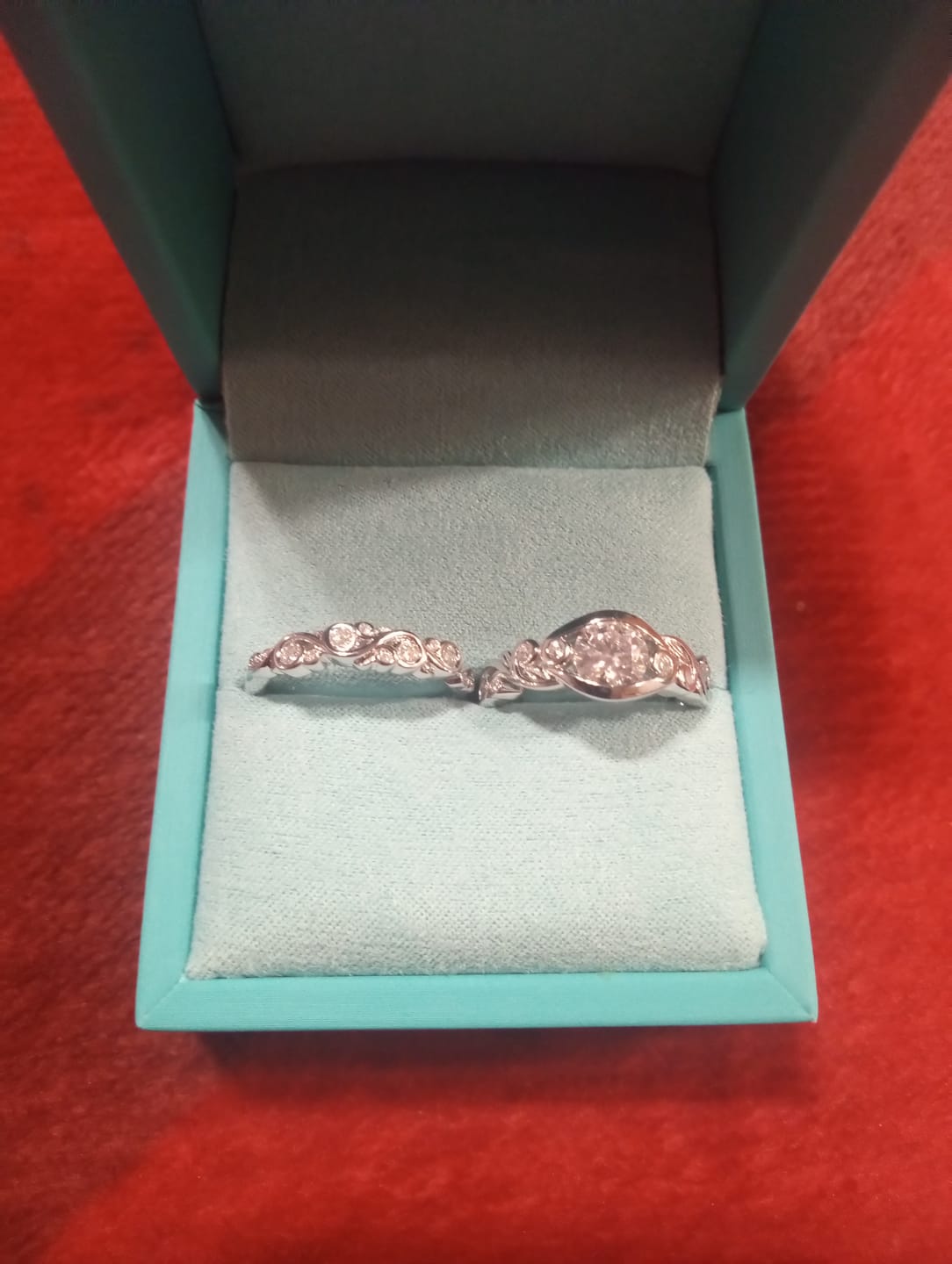 Customer photo review of Bezel Set Round Moissanite Scroll Accents Engagement Ring
