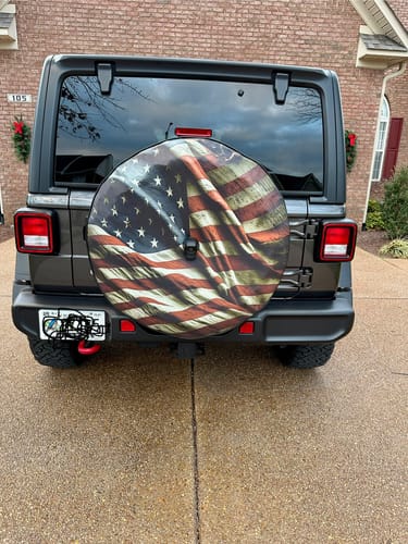 Customer photo review of Vintage Wavy Tattered American Flag Spare Tire Cover for Jeeps, Broncos, Campers, Vans, RV, & More