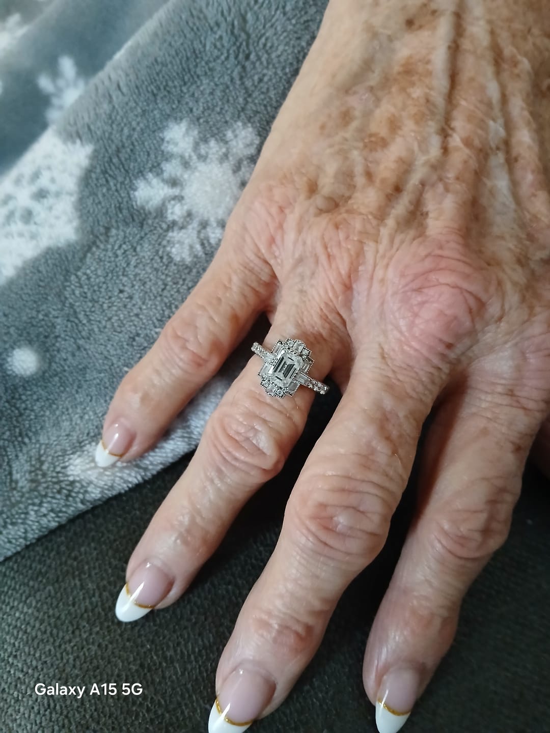 Customer photo review of Art Deco Emerald Cut Moissanite Milgrain Engagement Ring