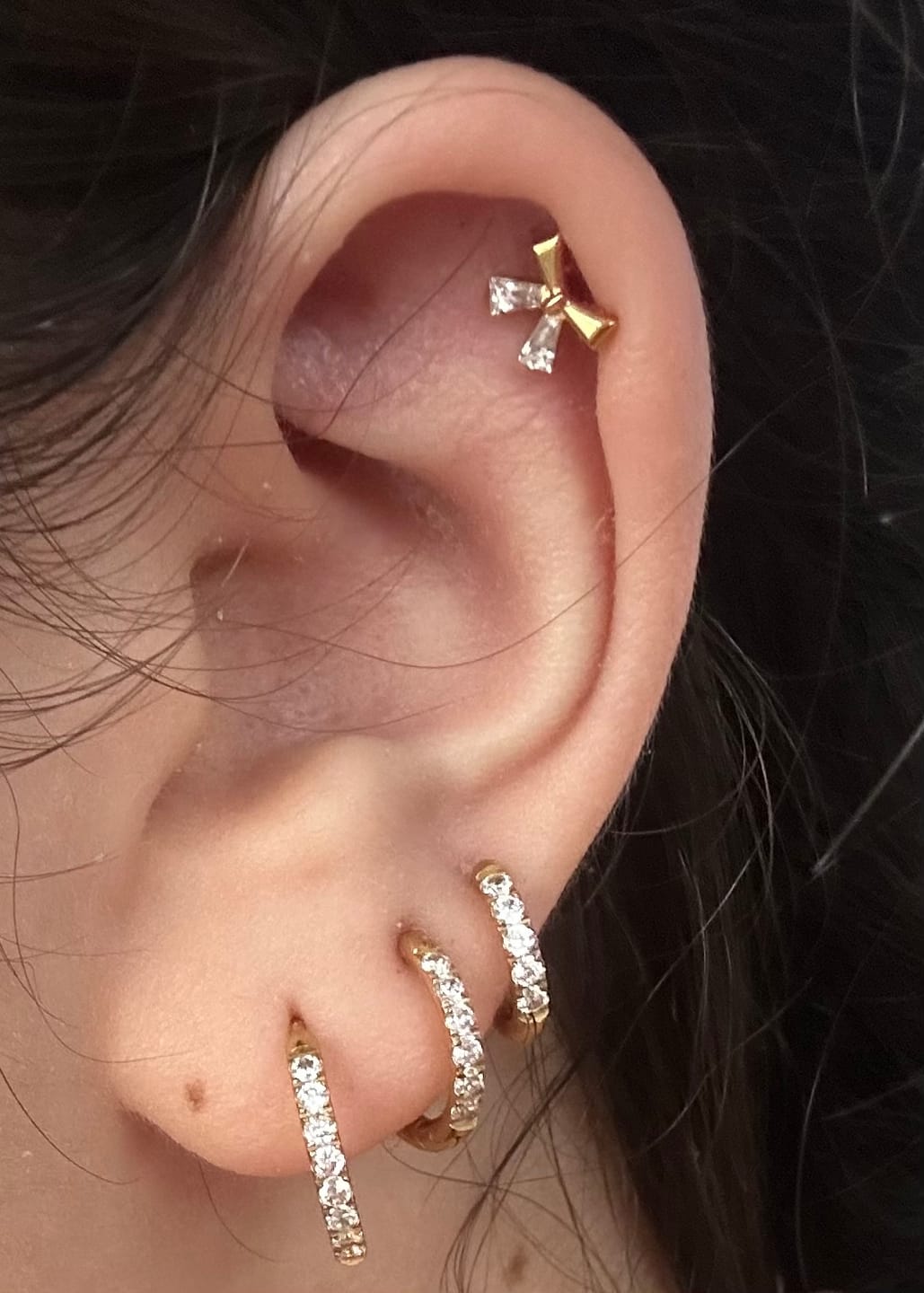 Customer photo review of Bow Tie Piercing | Titan