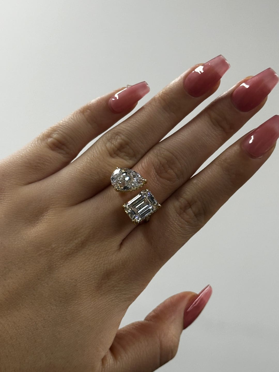 Customer photo review of Louily Unique Double Stones Design Emerald Cut & Pear Cut Engagement Ring