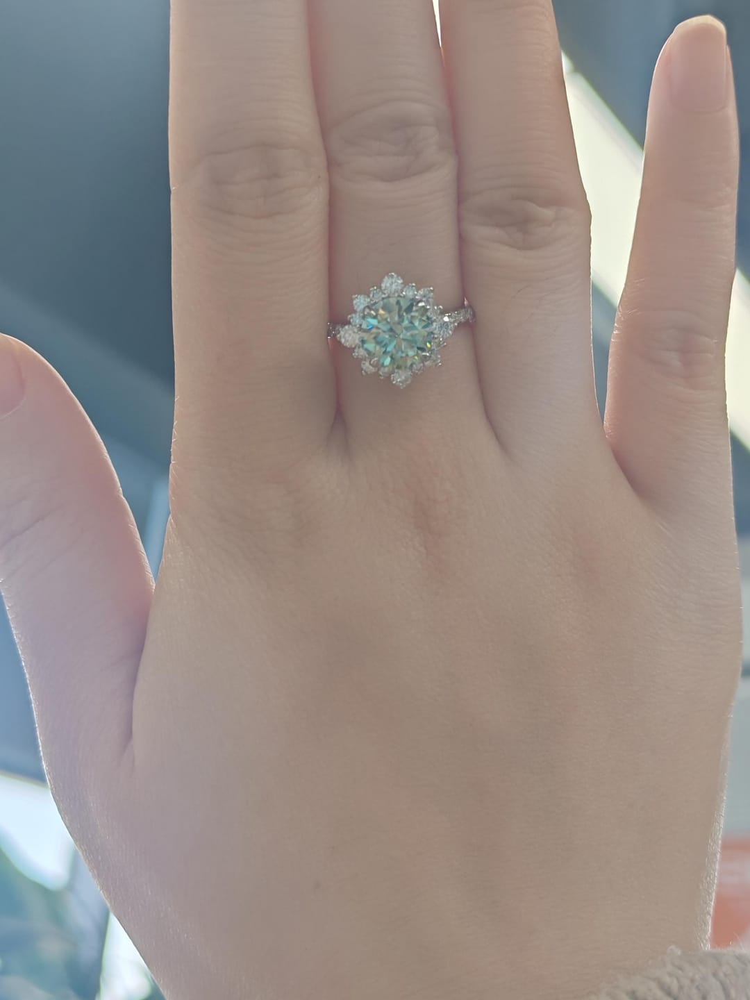 Customer photo review of S925 Moissanite 2 Ct Snowflake Design Halo Round Cyan Blue Stone Engagement Ring