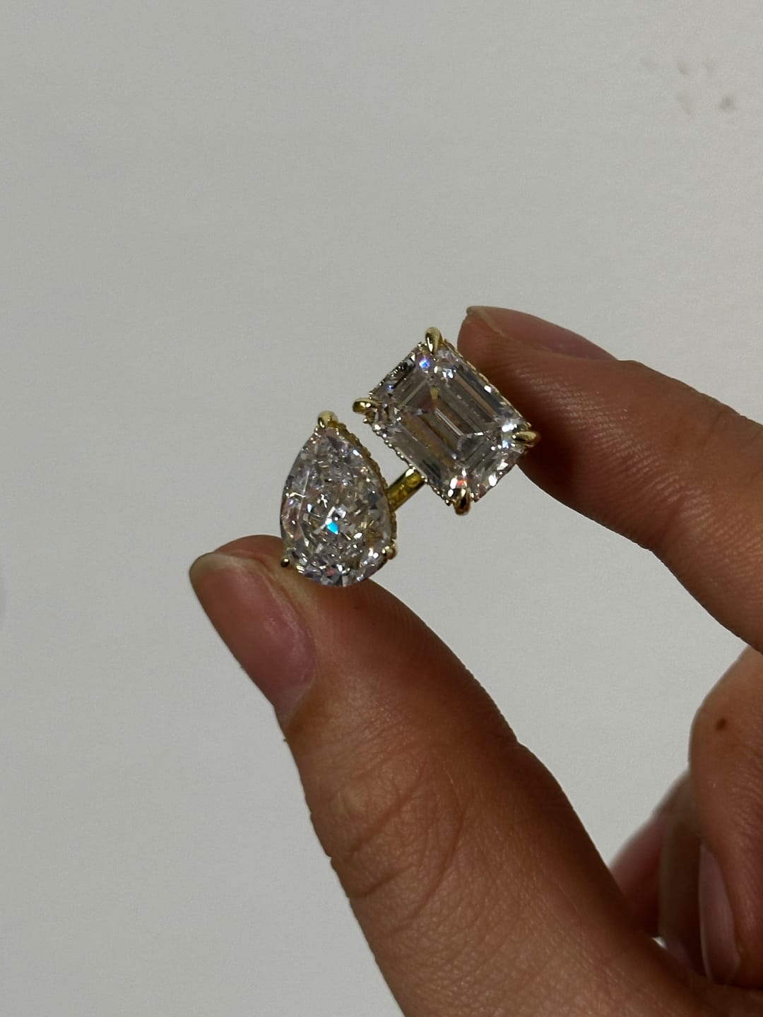 Customer photo review of Louily Unique Double Stones Design Emerald Cut & Pear Cut Engagement Ring