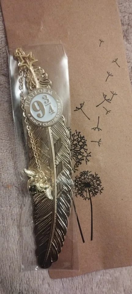 Customer photo review of Harry Potter Gold Feather Bookmarks