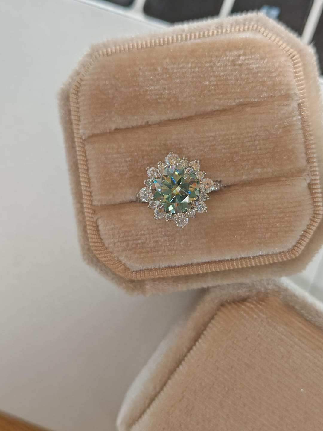 Customer photo review of S925 Moissanite 2 Ct Snowflake Design Halo Round Cyan Blue Stone Engagement Ring
