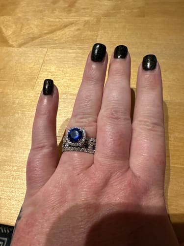 Customer photo review of Louily Stunning Halo Round Cut Blue Sapphire Engagement Ring In Sterling Silver