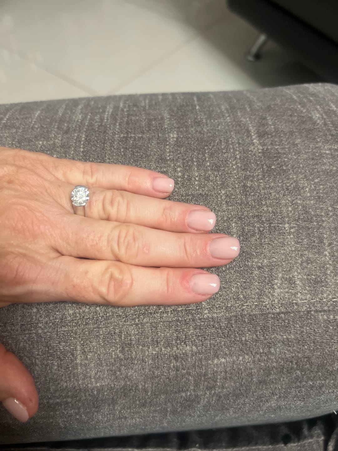 Customer photo review of Solitaire Moissanite Half Bezel Set Sterling Silver Engagement Ring