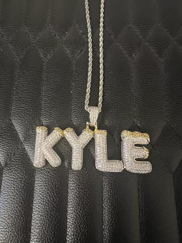 Customer photo review of CUSTOM ICED OUT BUBBLE LETTERS WITH SNOW PENDANT