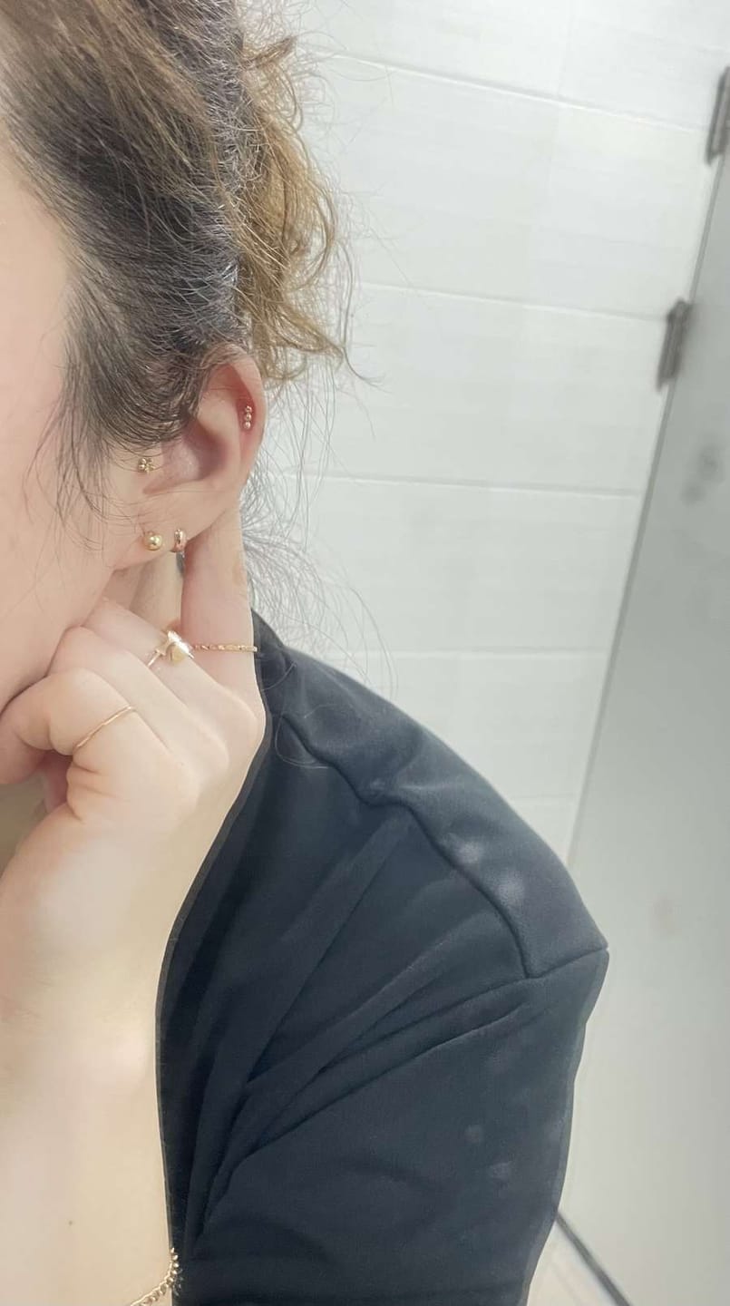 Customer photo review of 14K Gold Mini Helix Hoop Earring