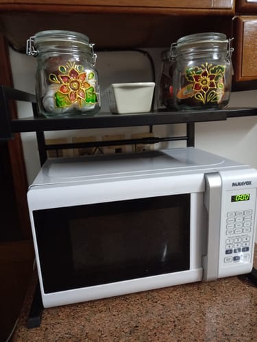 Customer photo review of Estante organizador de metal para microondas