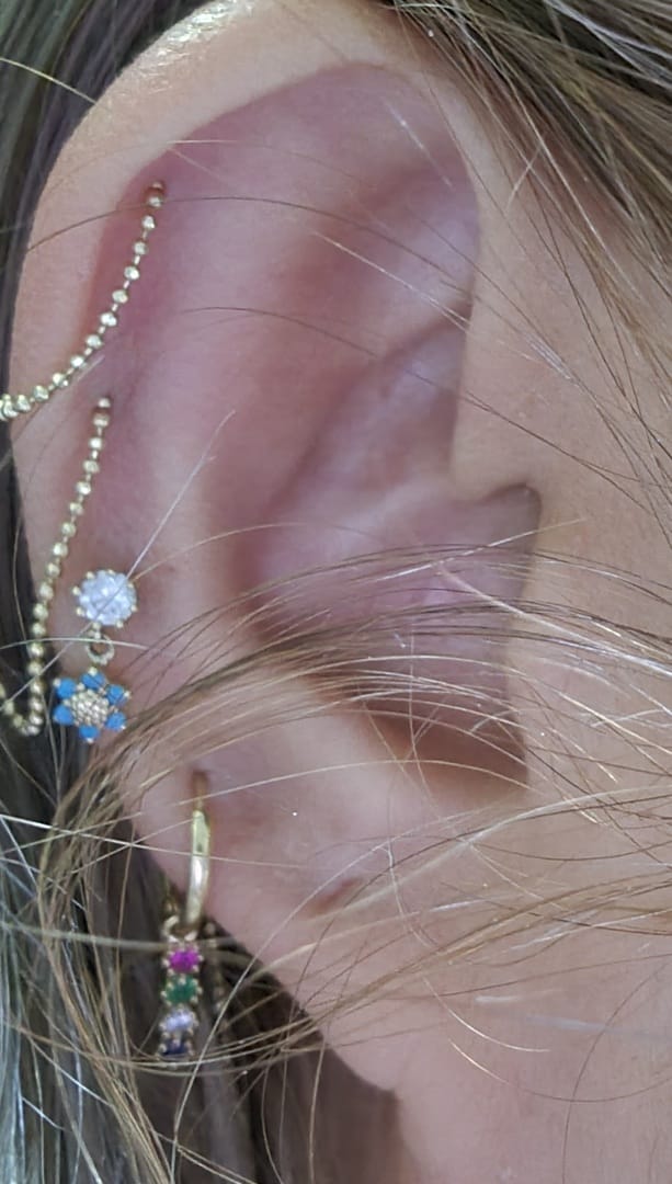 Customer photo review of 14K Gold Mini Flower Dangle Cartilage Earring 18G16G