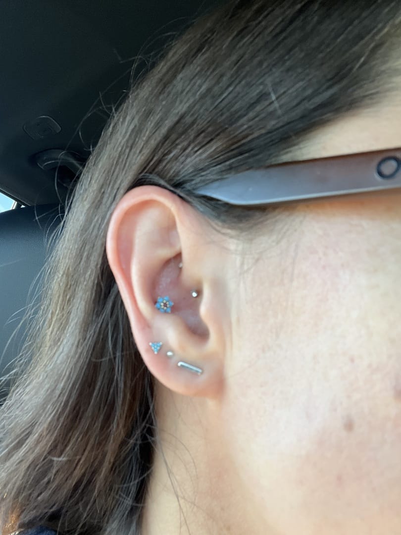Customer photo review of 14K Gold Lovely Flower Labret Piercing 18G16G