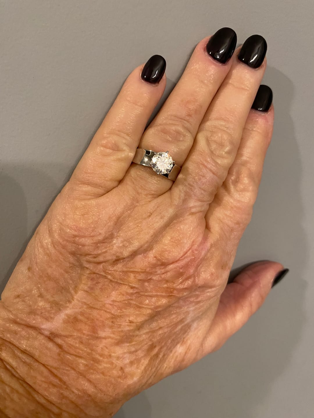 Customer photo review of Solitaire Round Moissanite Concave Wide Band Engagement Ring