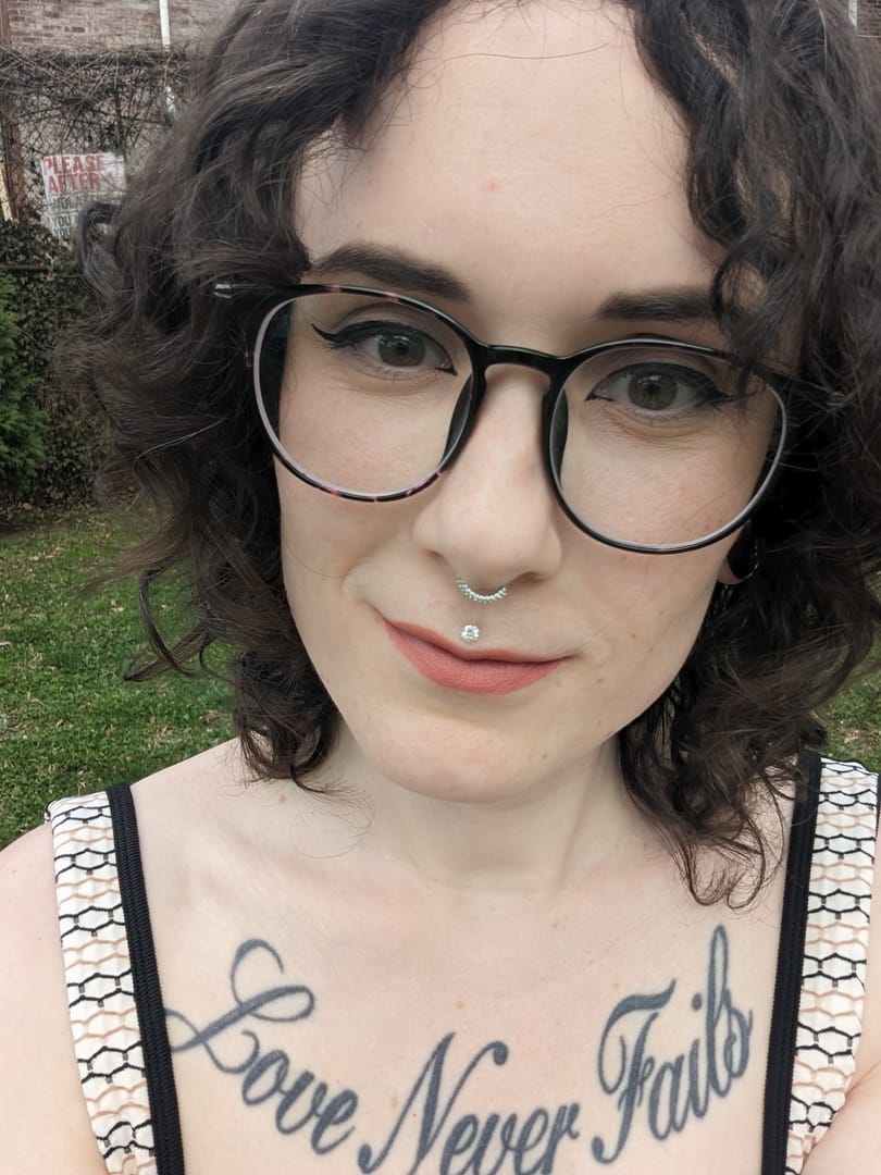 Customer photo review of 14K Gold Moissanite 6 Pronged Internally Threaded Labret Piercing 18G16G