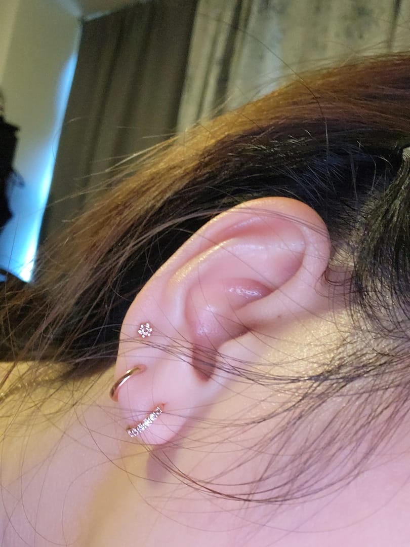 Customer photo review of 925 Silver Mini Flower Stud Earring