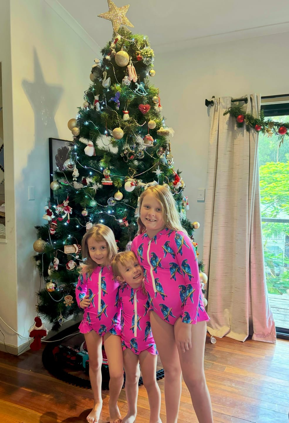 Customer photo review of Fluro Macaw Girls Long Sleeve Zip Swimmers