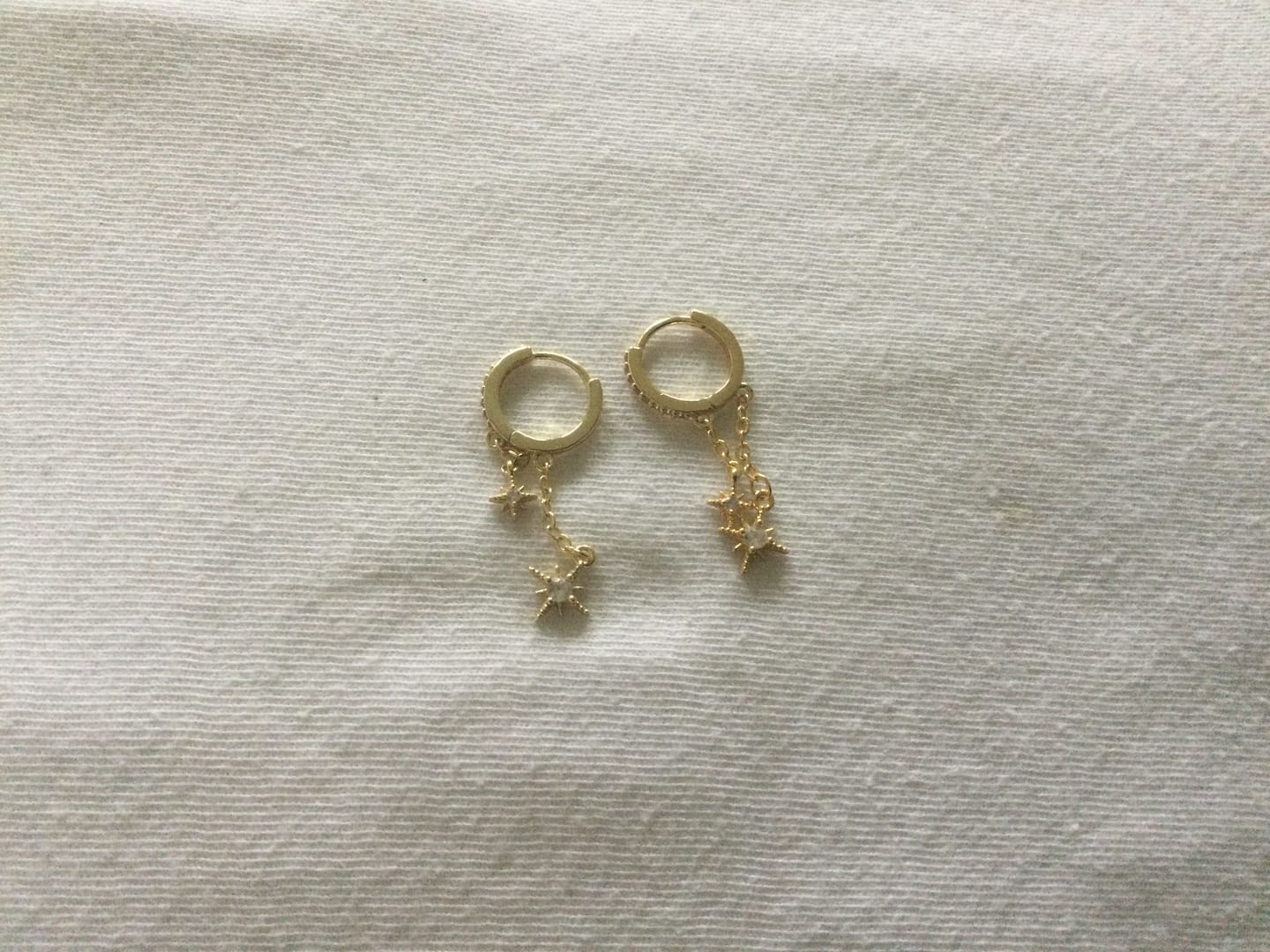 Customer photo review of Winny - Crystal Stars on Chain Hoop Earrings