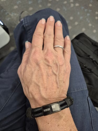 Customer photo review of Valhalla Warrior Morse Code ‘Never Surrender’ Leather Bracelet: Helps Pair Veterans With A Service Dog Or Shelter Dog