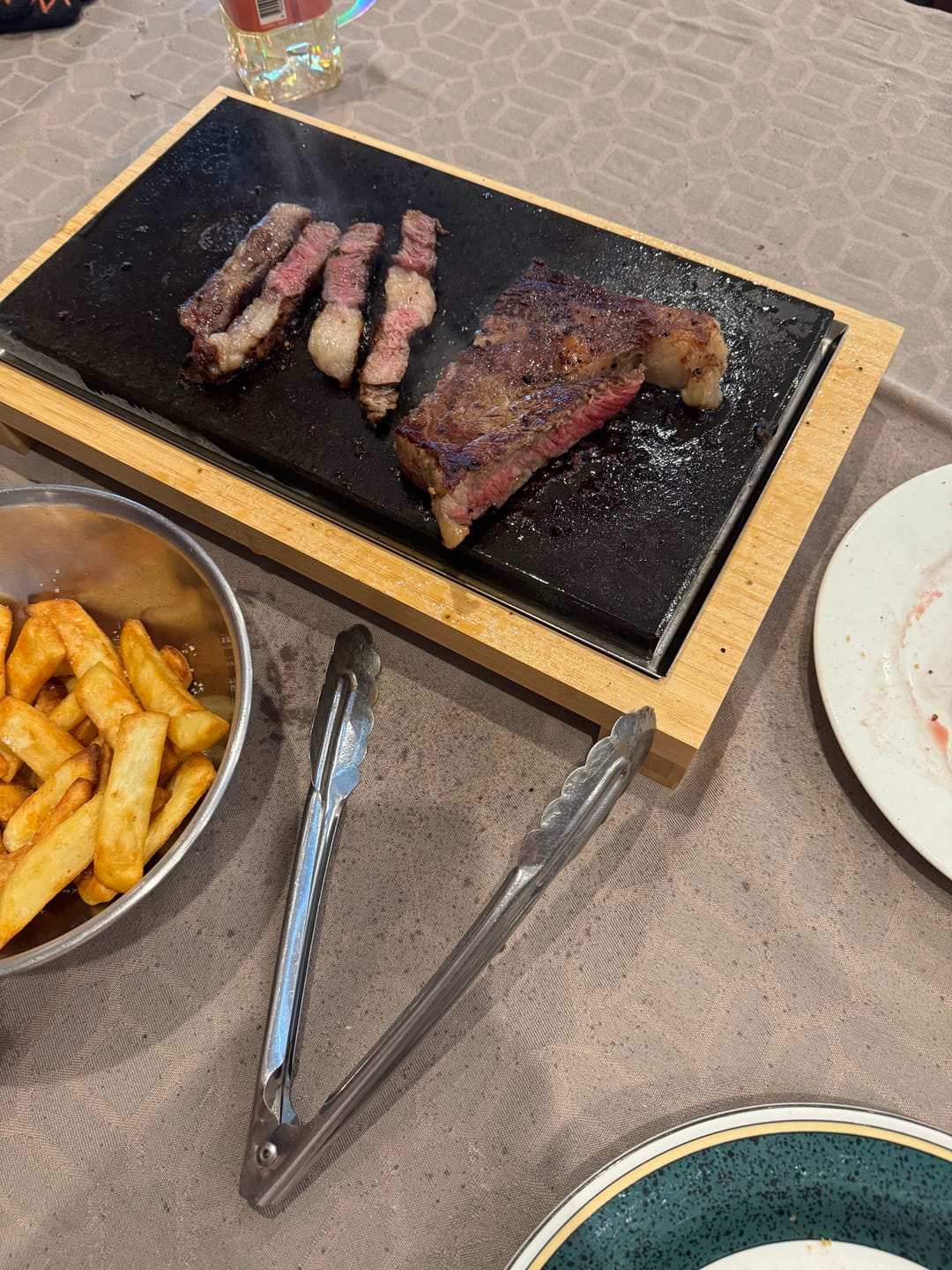 Customer photo review of The SteakStones Raised Sharing Steak Plate
