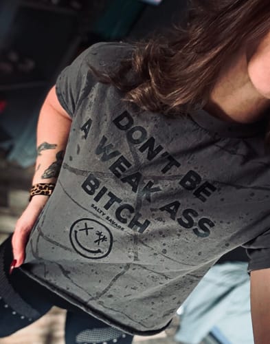 Customer photo review of Salty Savage Ladies “Don’t Be A Weak Ass Bitch" Paint Splatter Crop Tee