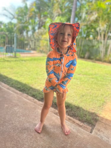 Customer photo review of Fluro Orange Sharks Girls Long Sleeve Zip Swimmers