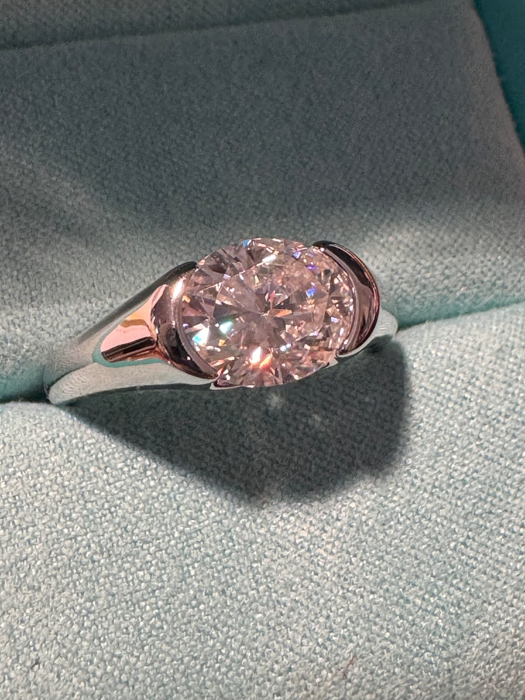 Customer photo review of Solitaire Oval Moissanite Half Bezel Set Engagement Ring