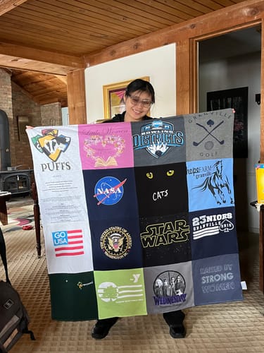 T-shirt quilt with sports, science fiction themes by Sheila from OH