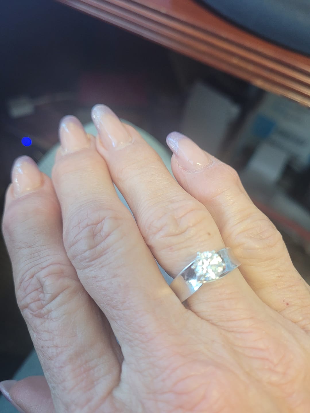 Customer photo review of Solitaire Round Moissanite Concave Wide Band Engagement Ring