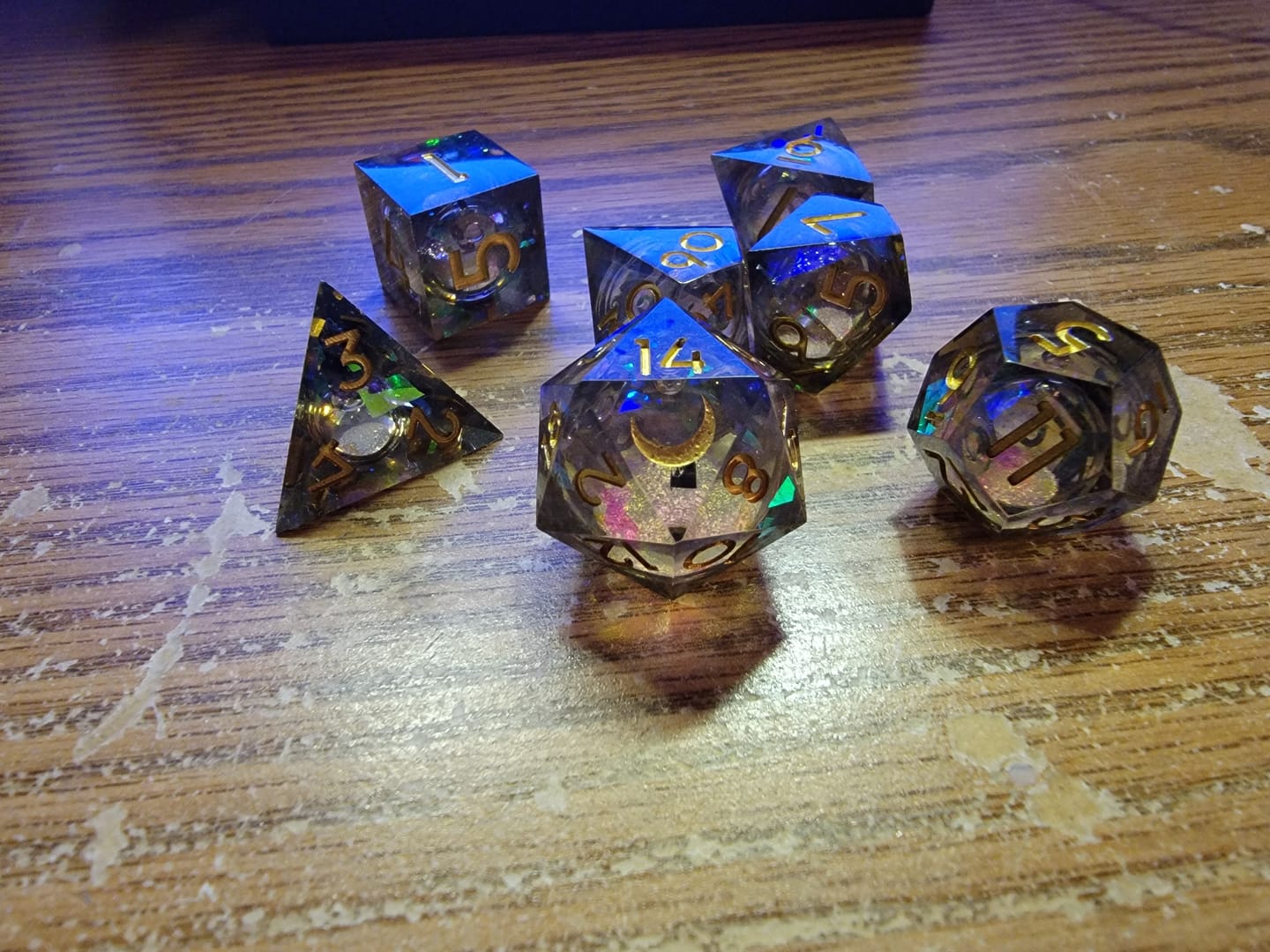 Customer photo review of URWizards D&D Dark Glitter Liquid Heart Resin Engraved Dice Set Moon