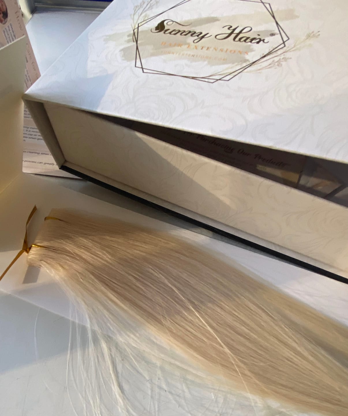 Customer photo review of Seamless Tape in Hair Extensions Best Virgin Hair Lightest Blonde #60