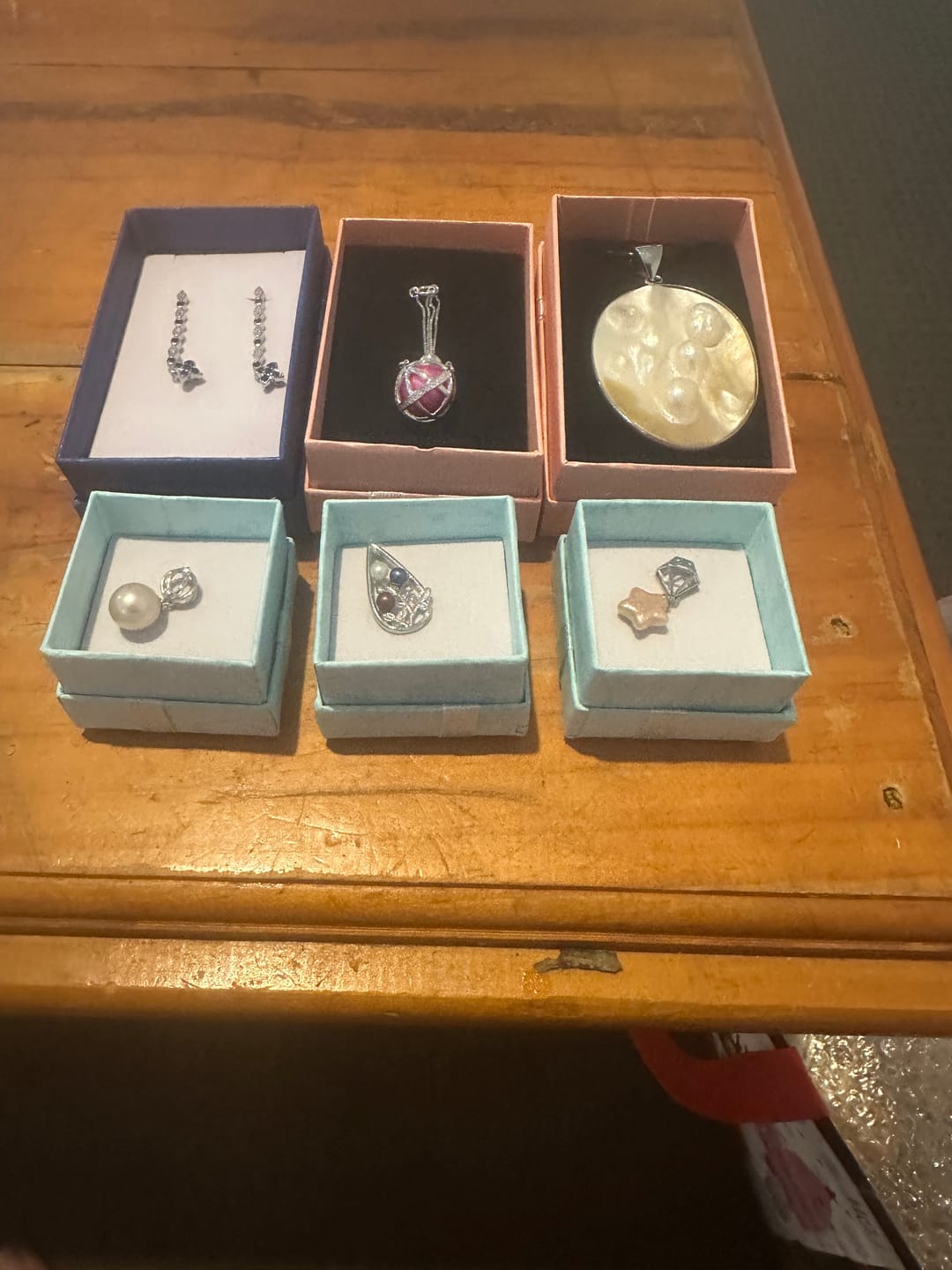 Customer photo review of Cage Pendant 925 Sterling Silver - Pearl Cradle Basket ½” x ¼”