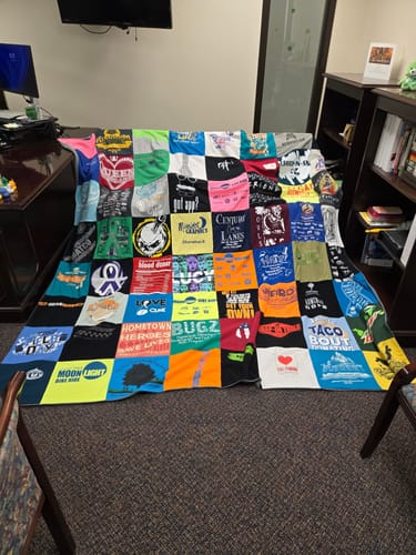 T-shirt quilt with community, food themes by Tara from MO