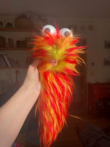 Customer photo review of Red Orange on Lemon Spiked Three Tone Faux Fur Fabric