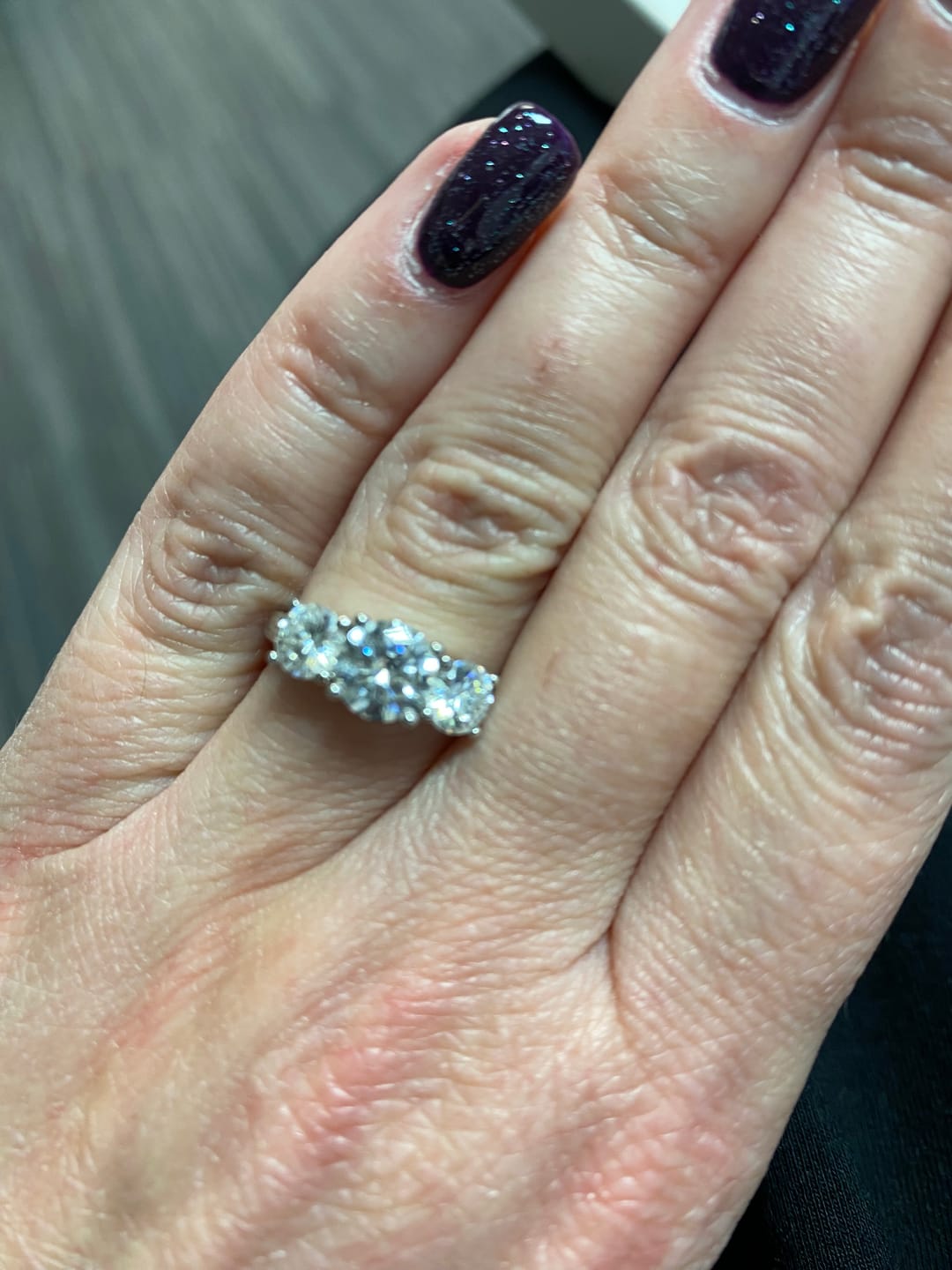 Customer photo review of Classic Three Stone Round Cut Moissanite Engagement Ring