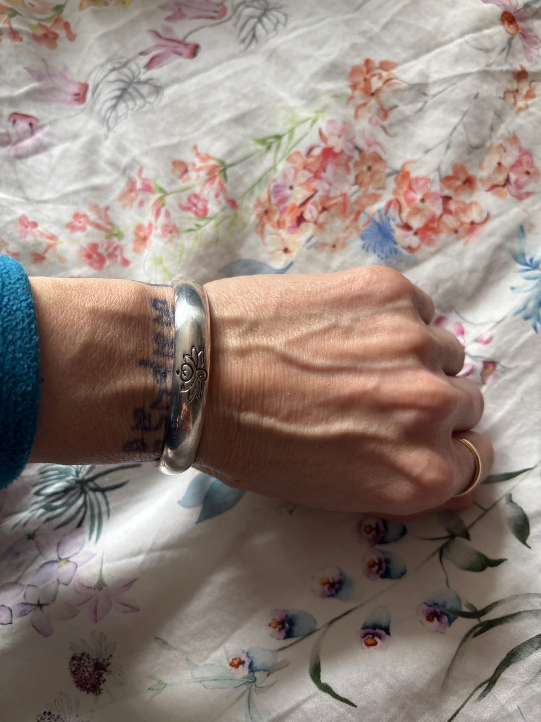 Customer photo review of Buddha Stones Lotus Flower Heart Sutra White Copper Healing Luck Bracelet