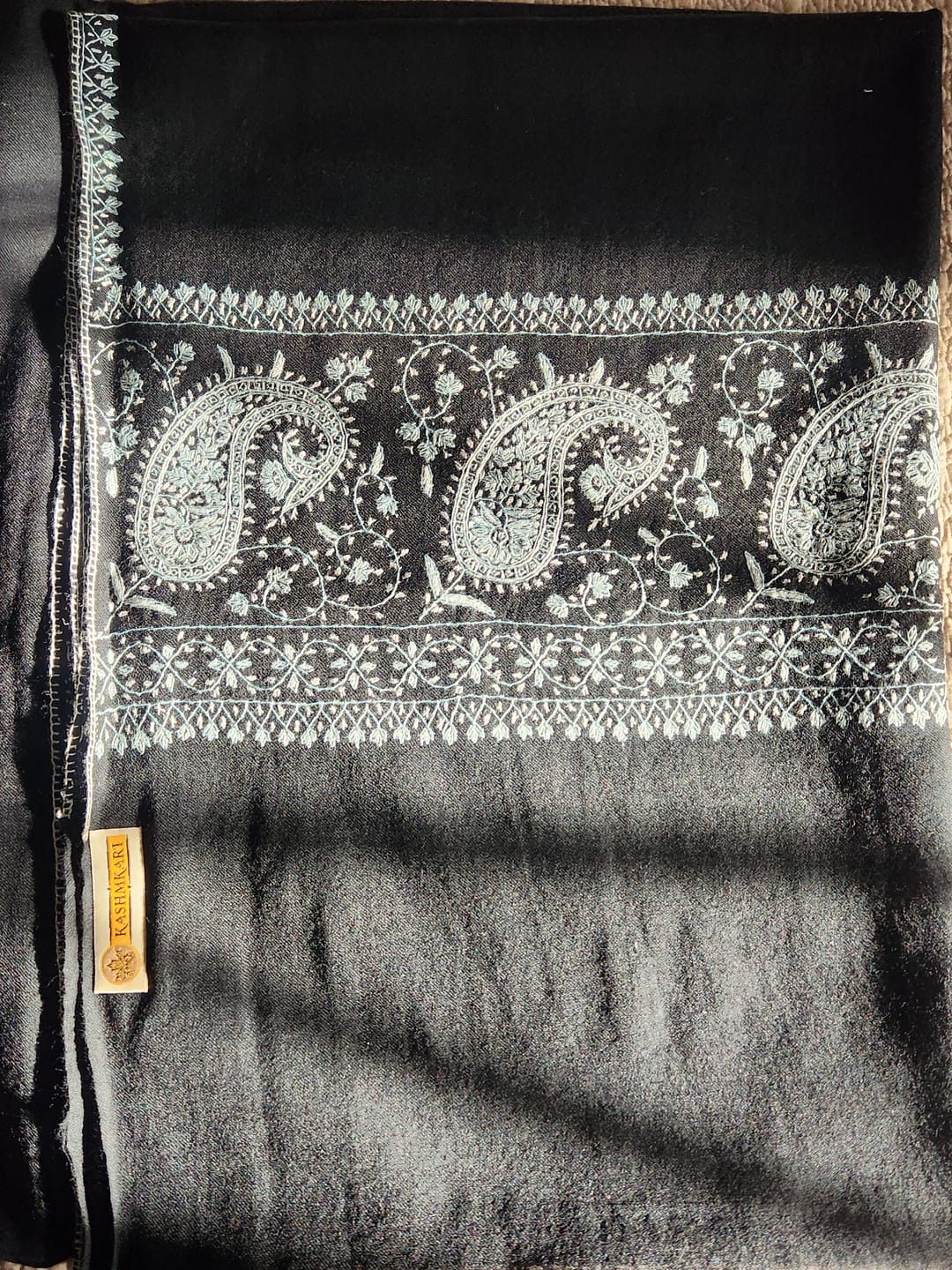 Customer photo review of Midnight Sozni: Hand-Embroidered Merino Wool Shawl in Black and Aqua