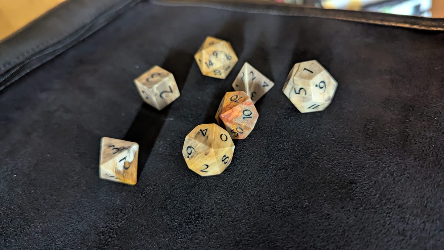 Customer photo review of URWizards D&D Petrified Wood Gemstone Engraved Dice Set(Limited edition)