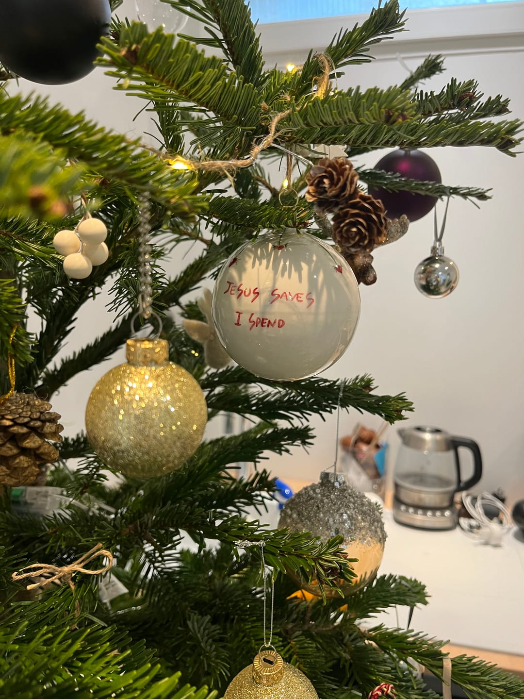 Customer photo review of "Jesus Saves I Spend" Christmas ball