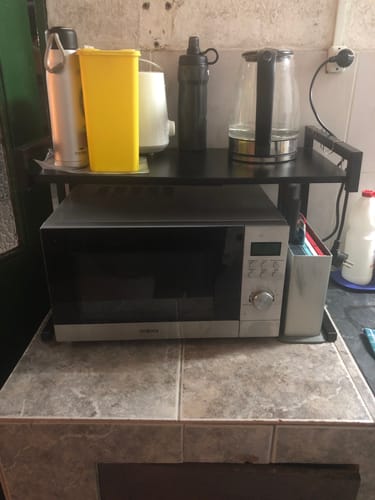Customer photo review of Estante organizador de metal para microondas