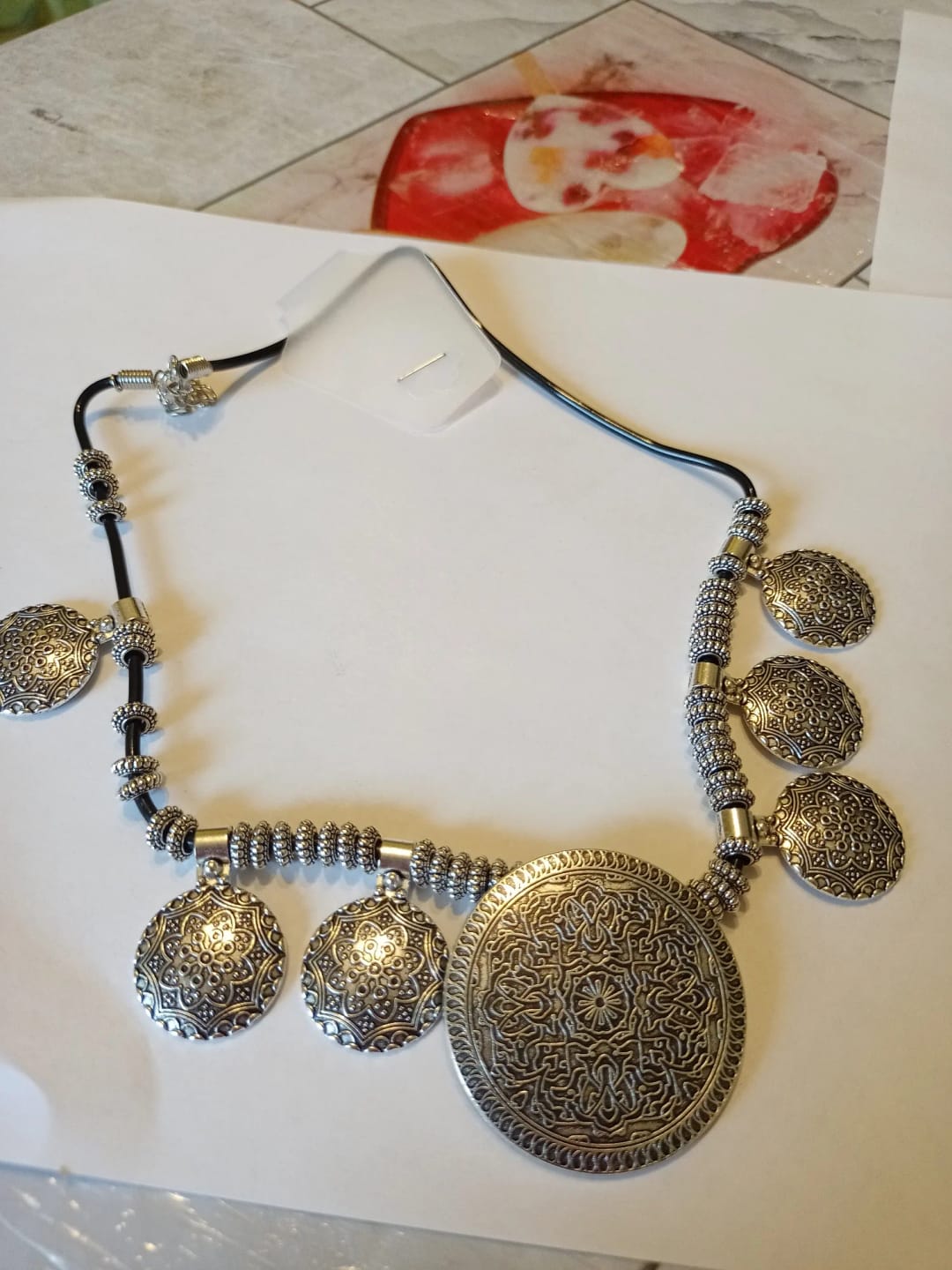 Customer photo review of Bohemian Tibetan Necklace Carved Flower Pendant Tassels — Silver-Toned | KIMLUD