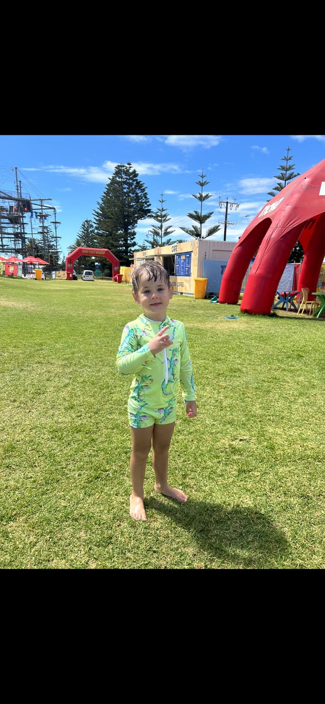 Customer photo review of PREORDER Fluro Dragon Unisex Long Sleeve Zip Swimmers (Ships w/c 6th May)