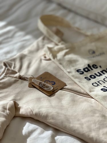 Customer photo review of Organic Cotton & Camel Wool Warm Long Sleeve Sleep Sack With Feet 2.5 TOG - Cream