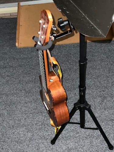 Customer photo review of SCL-VH Ukulele Holder clamps to your Table, Music stand or Mic stand: Safety, Convienence, Space Saving