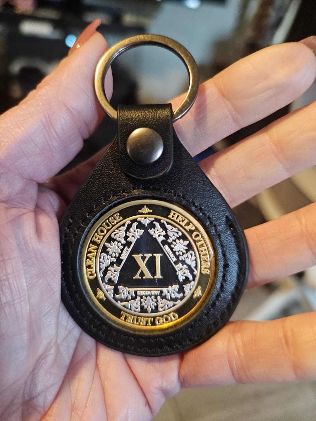 Customer photo review of Sobriety Mint Genuine Leather 40mm AA Medallion Keychain Holder - Recovery Chip/Coin/Token Holder - Black