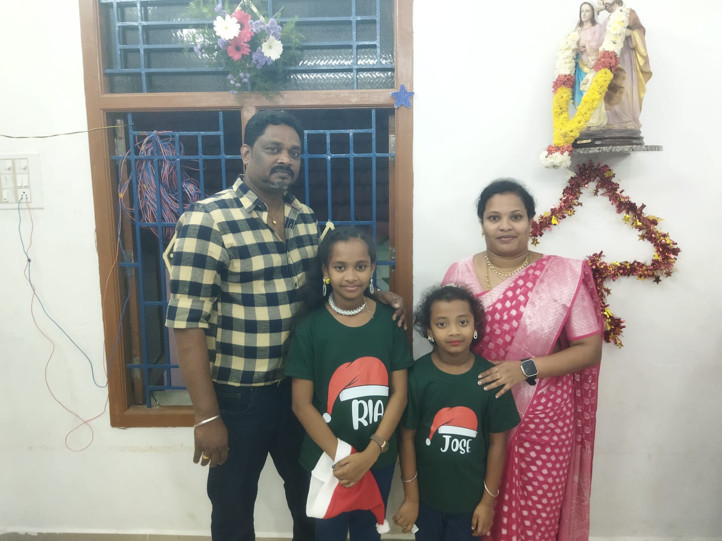 Customer photo review of Santa Hat With Custom Kids Name Tee